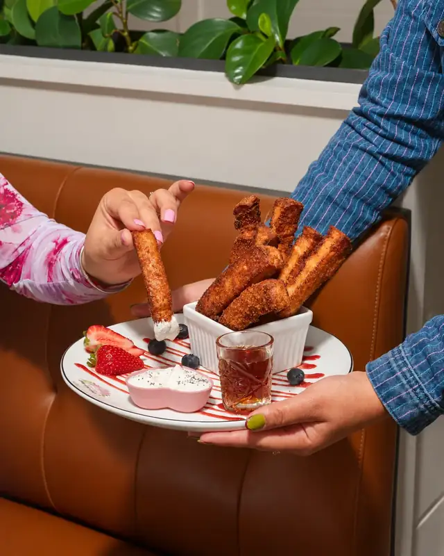 French toast sticks with cream and berries