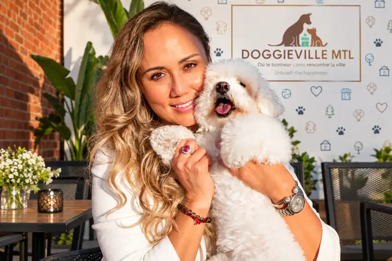 Tatiana Custode, founder of Ruby Café MTL, with Ruby the bichon